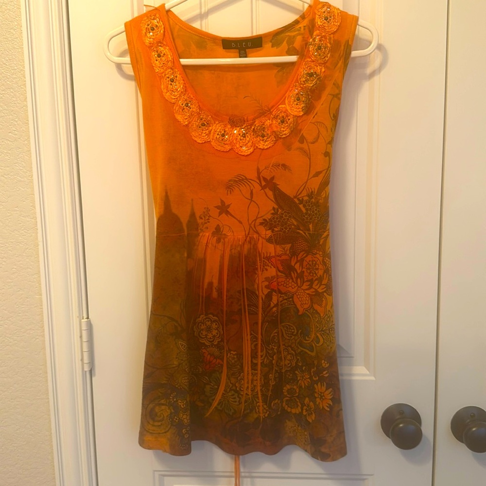 Beautiful B.L.E.U Short Sleeve Tunic With Details Around Neck Line And Tie